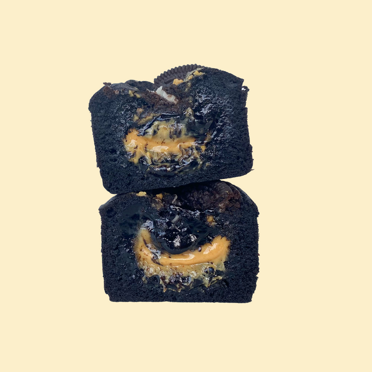 Close-up cross-section of oreo peanut butter brownie showing swirls and oreo pieces