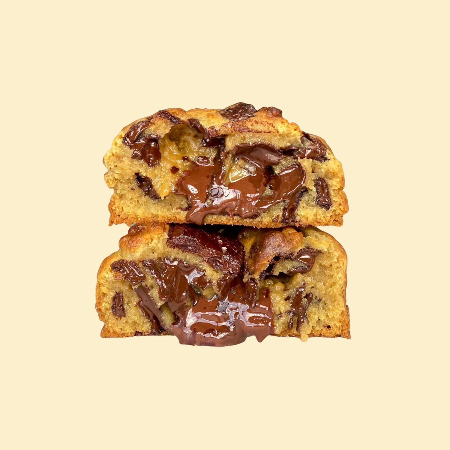 Chunky chocolate chip cookie on plate with glass of milk