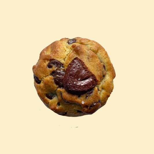 Chunky chocolate chip cookie with dark chocolate chunks on white background