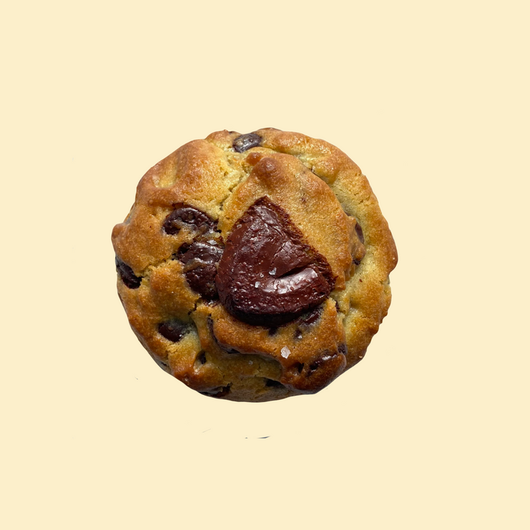 Chunky chocolate chip cookie with dark chocolate chunks on white background