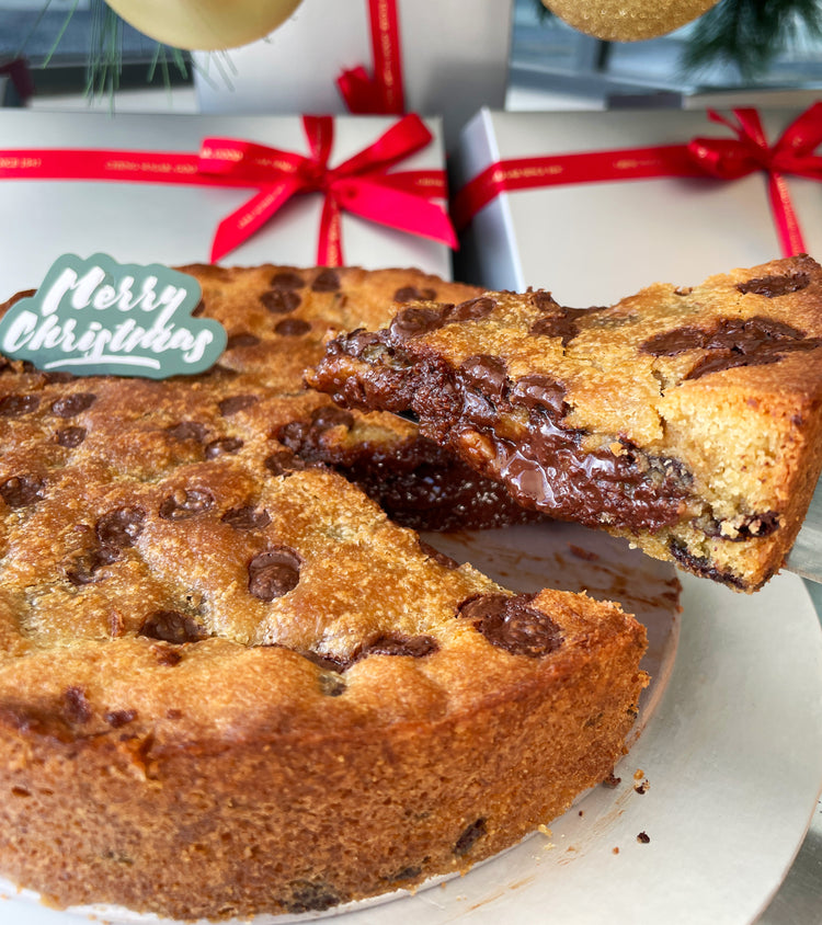 Close-up of chunky chocolate chip pro max showing gooey chocolate chunks and crisp edge